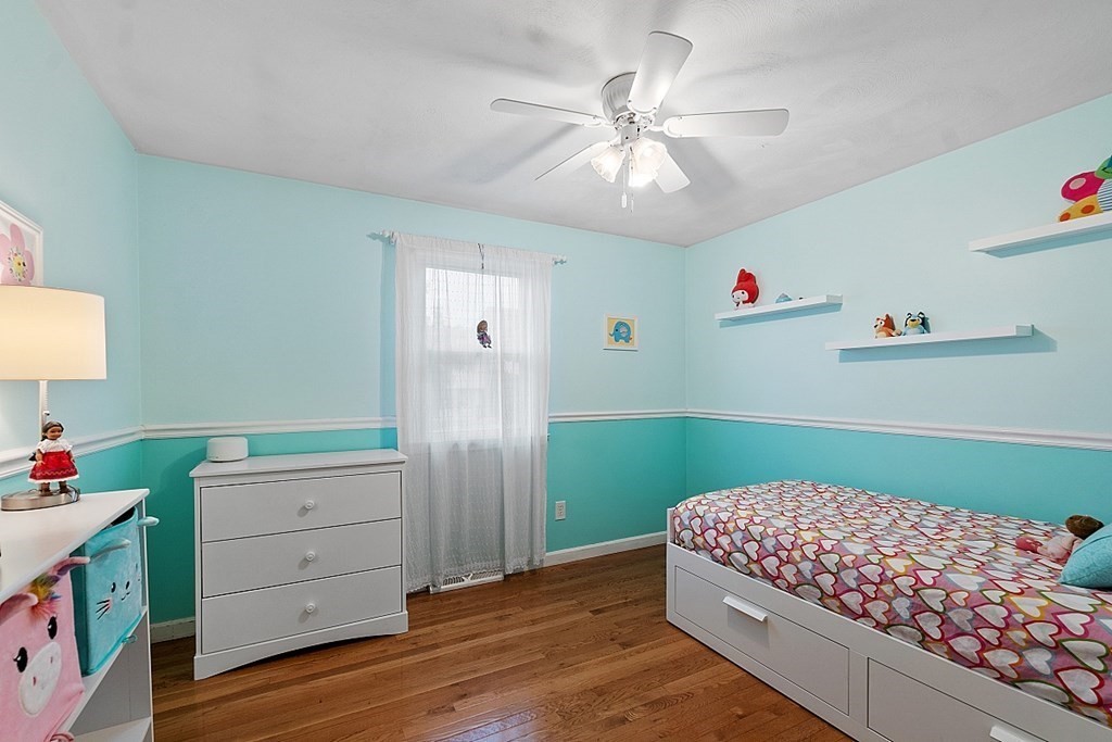 3 Neel Road Worcester, MA 01605 - Photo 22 of 41 a bedroom with a bed and a chandelier