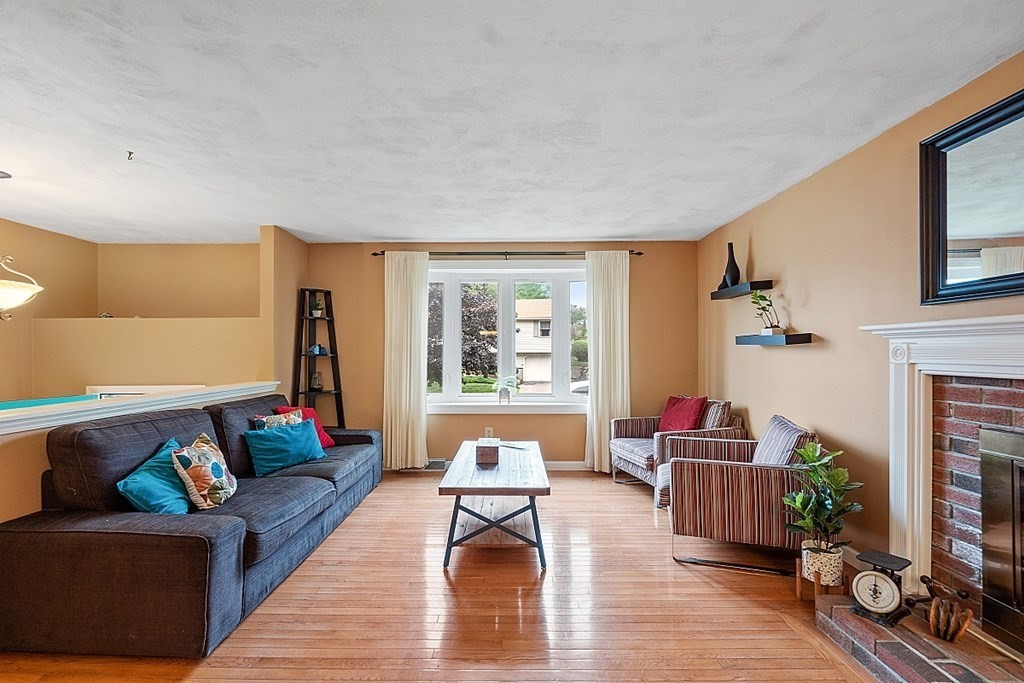 3 Neel Road Worcester, MA 01605 - Photo 7 of 41 a living room with furniture and a fireplace