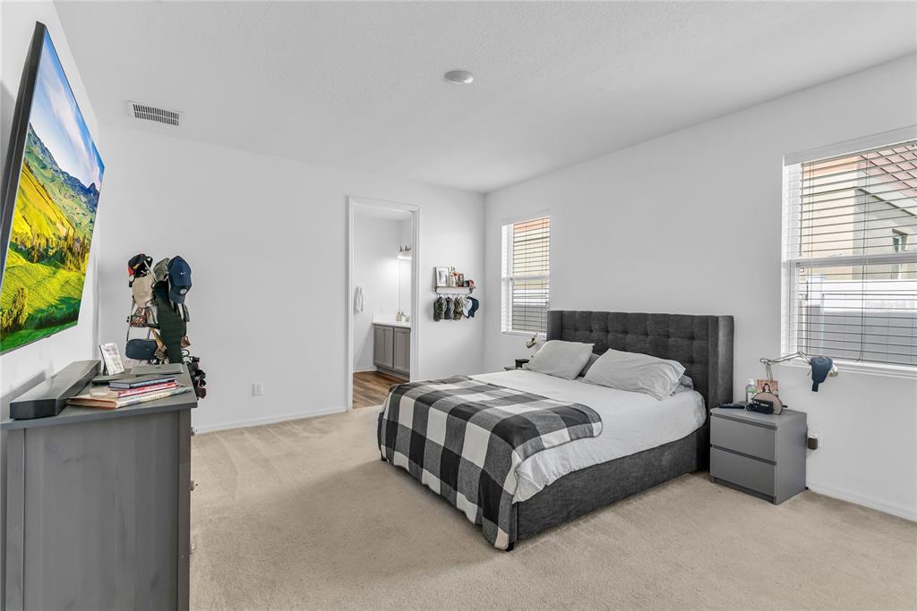 5816 Bar Ranch Road St. Cloud, FL 34771 - Photo 11 of 43 a bedroom with a bed and a flat screen tv