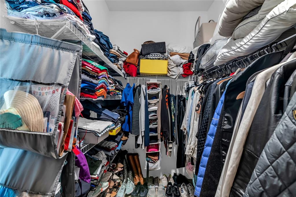 5816 Bar Ranch Road St. Cloud, FL 34771 - Photo 15 of 43 a view of walk in closet with clothes and shoes