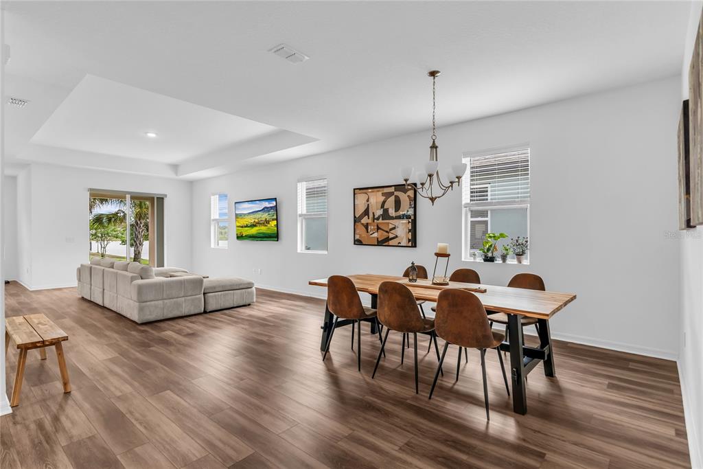 5816 Bar Ranch Road St. Cloud, FL 34771 - Photo 25 of 43 a living room with furniture and a wooden floor