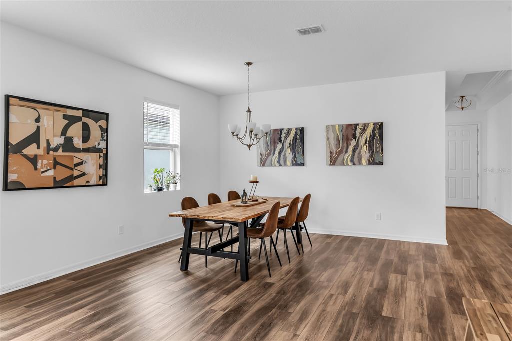 5816 Bar Ranch Road St. Cloud, FL 34771 - Photo 27 of 43 a view of a dining room with furniture and wooden floor