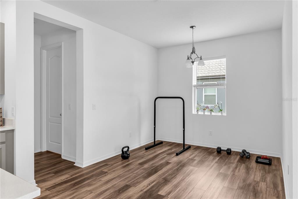 5816 Bar Ranch Road St. Cloud, FL 34771 - Photo 29 of 43 a view of empty room with wooden floor and fan