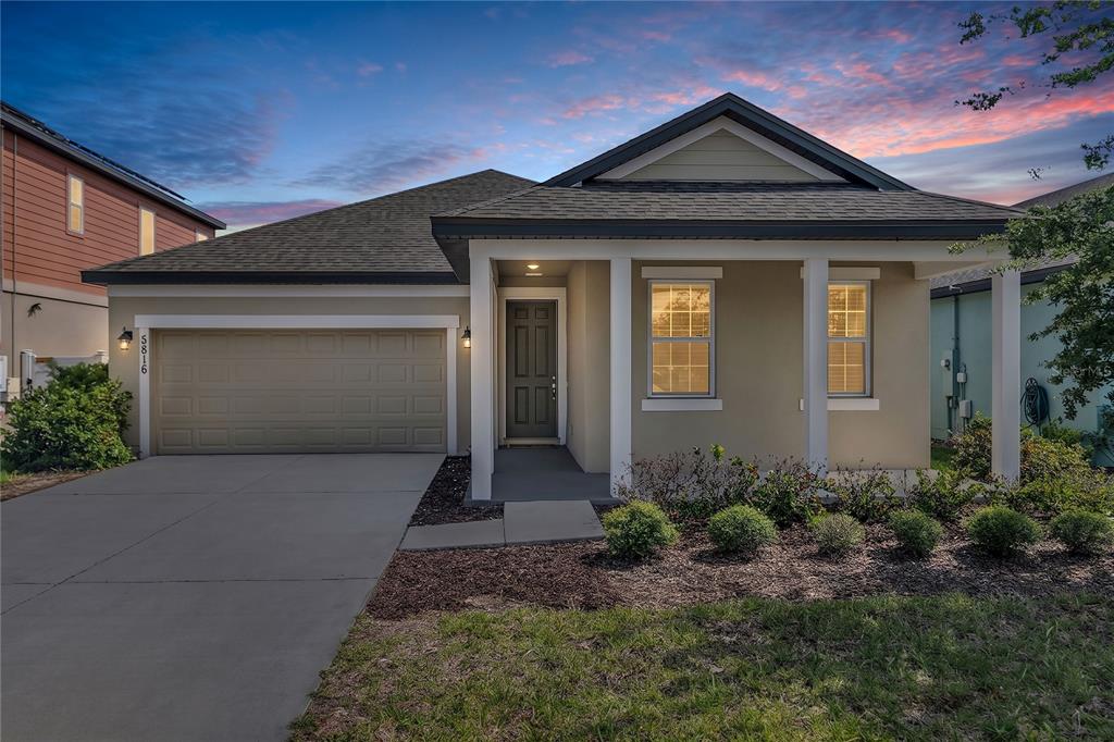 5816 Bar Ranch Road St. Cloud, FL 34771 - Photo 43 of 43 a front view of a house with garden
