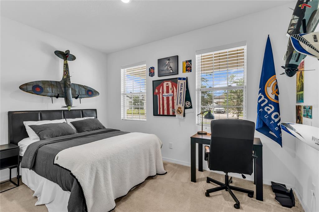 5816 Bar Ranch Road St. Cloud, FL 34771 - Photo 6 of 43 a bedroom with a bed and a chandelier
