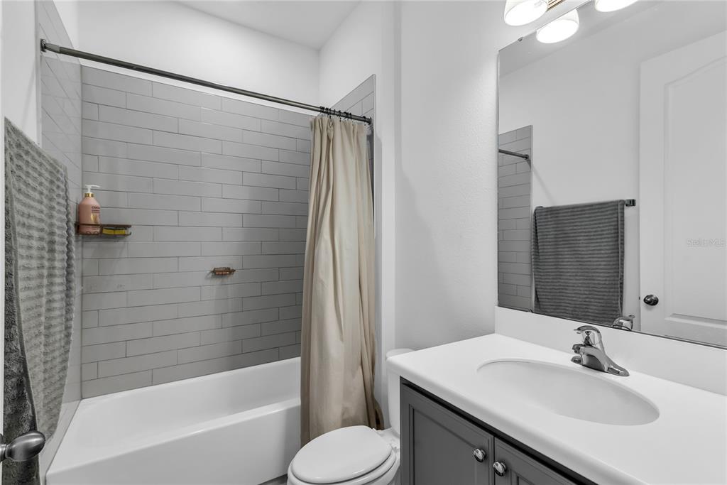 5816 Bar Ranch Road St. Cloud, FL 34771 - Photo 8 of 43 a bathroom with a sink toilet and shower