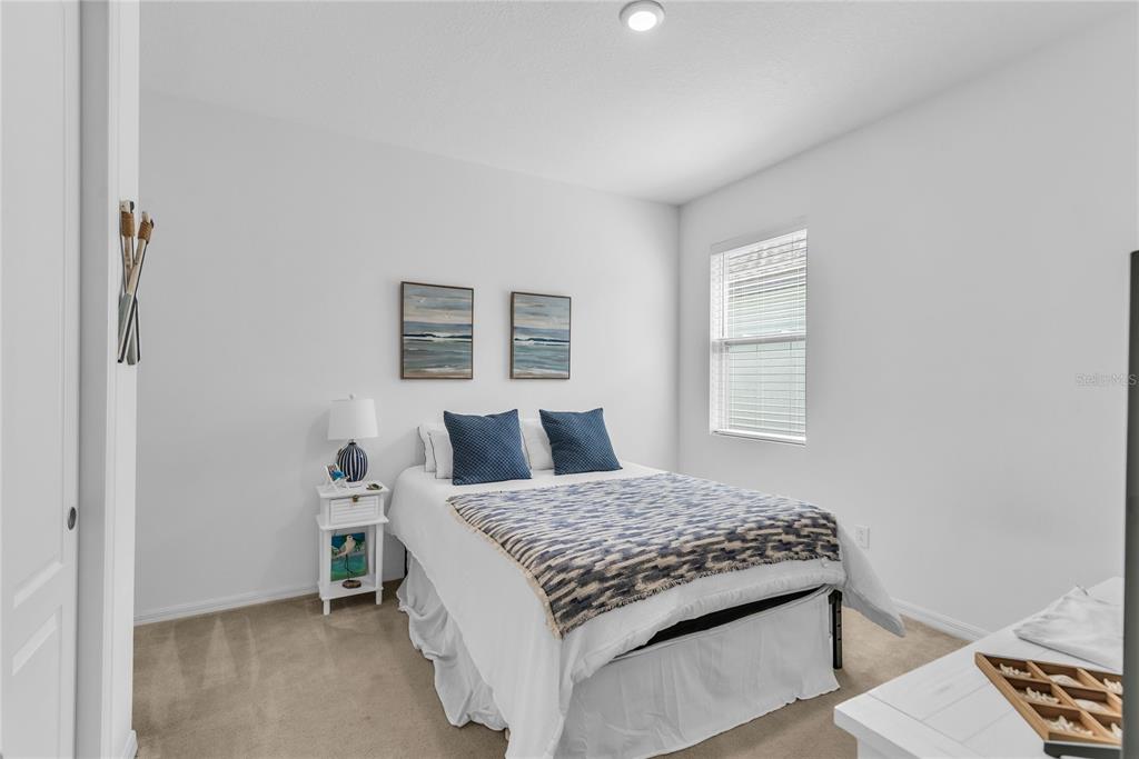 5816 Bar Ranch Road St. Cloud, FL 34771 - Photo 9 of 43 a bedroom with a bed and a window with rug
