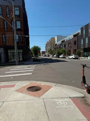 a view of a building and car parked