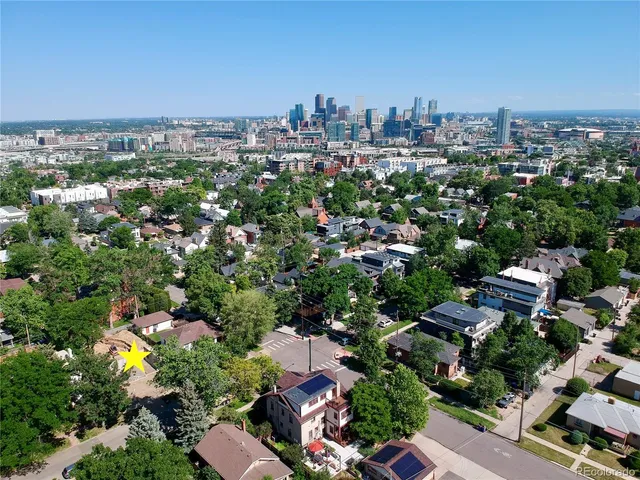 an aerial view of a city with lots of residential buildings