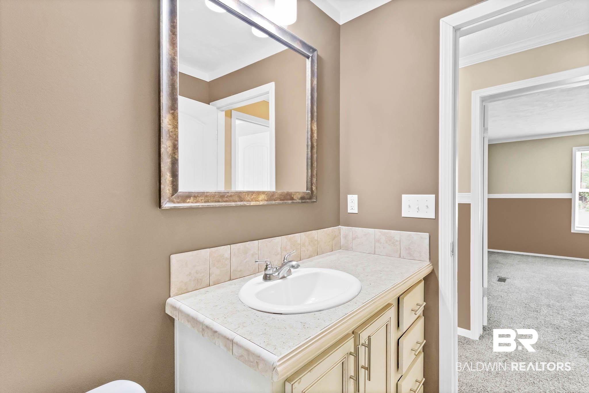 15064 Black Griffin Road Loxley, AL 36551 - Photo 28 of 38 Half bathroom with vanity
