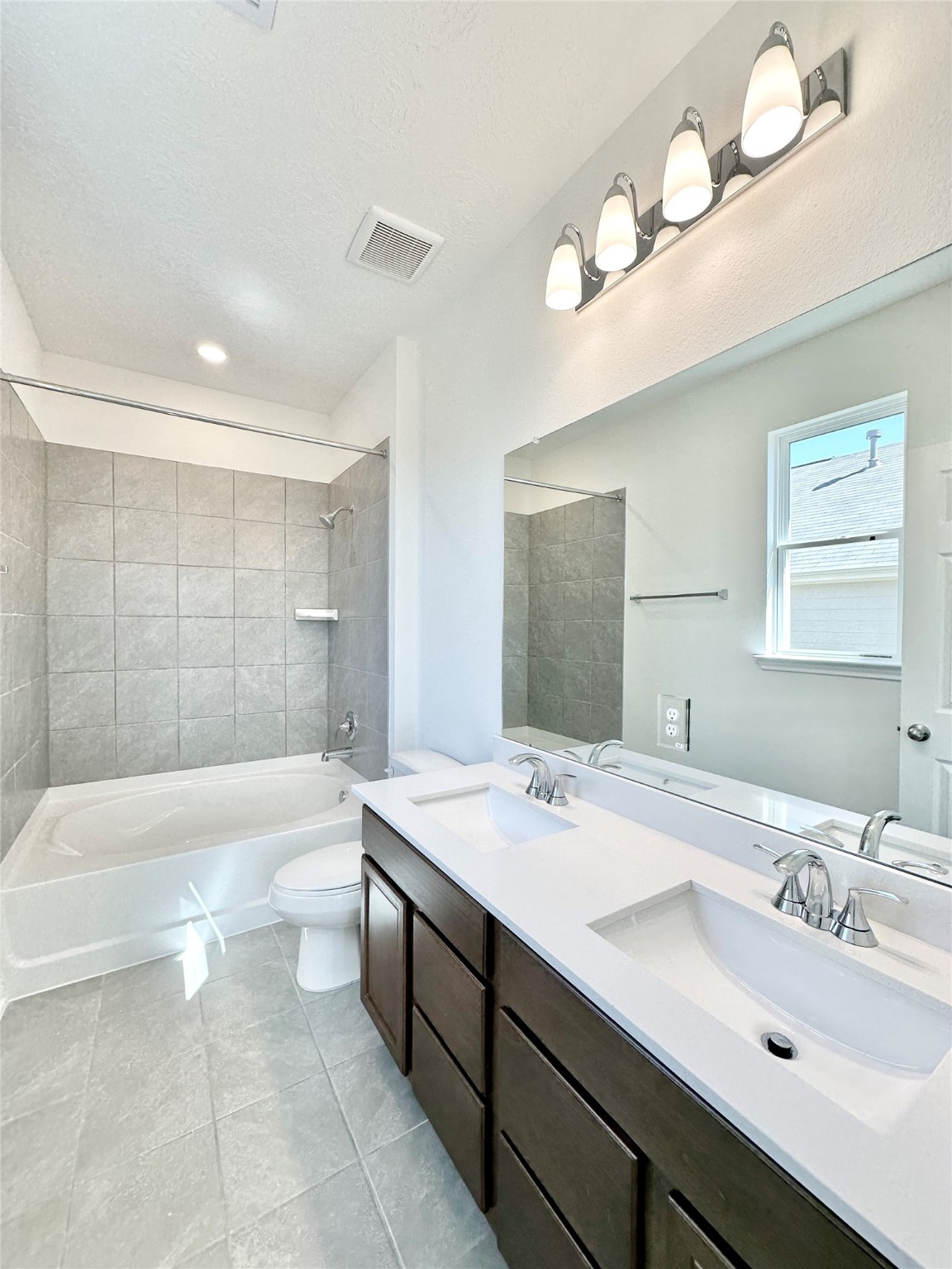 562 Broken Boulder Street Magnolia, TX 77355 - Photo 11 of 16 a bathroom with a tub double sink and mirror