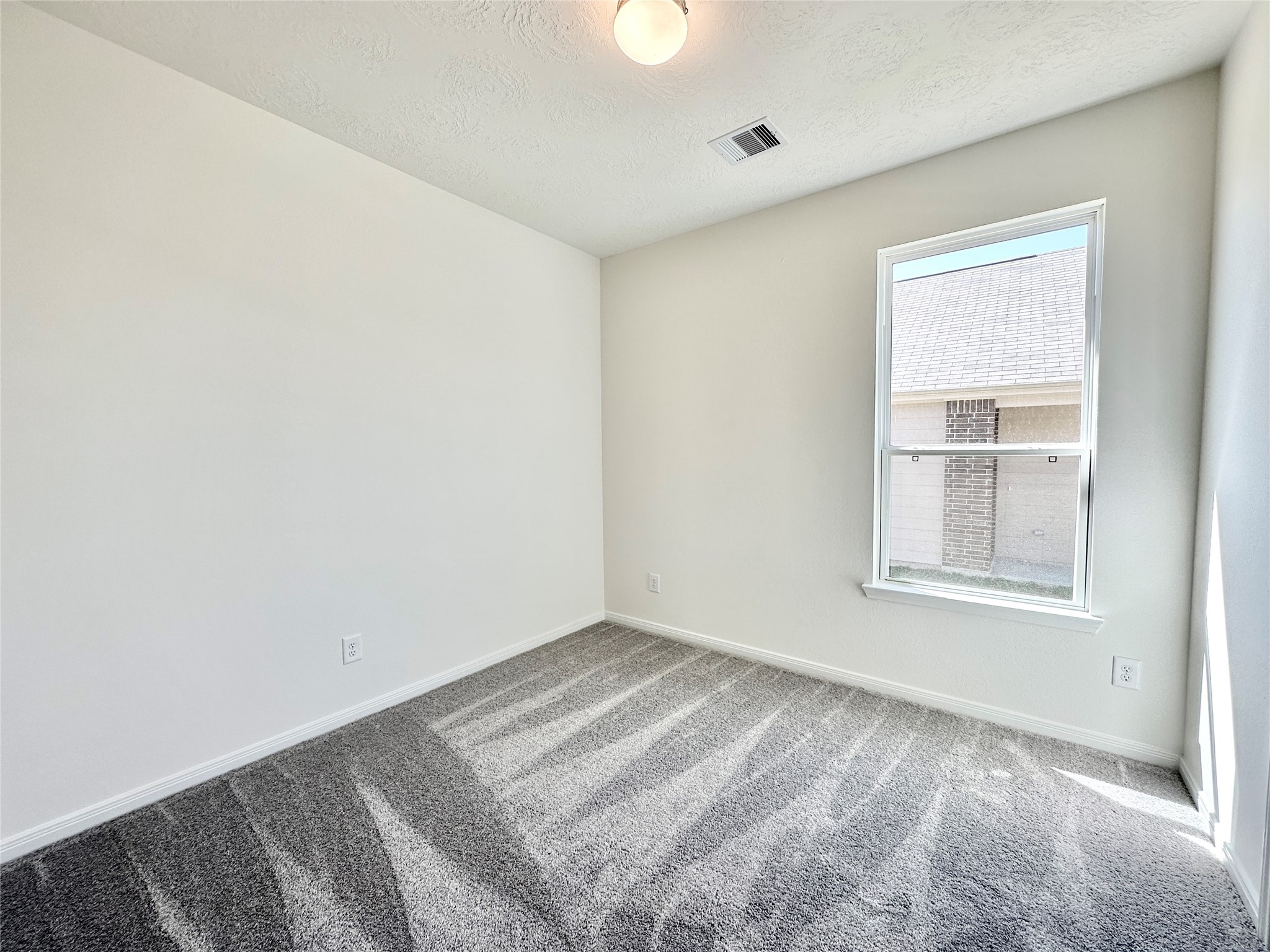 562 Broken Boulder Street Magnolia, TX 77355 - Photo 12 of 16 a view of an empty room with a window