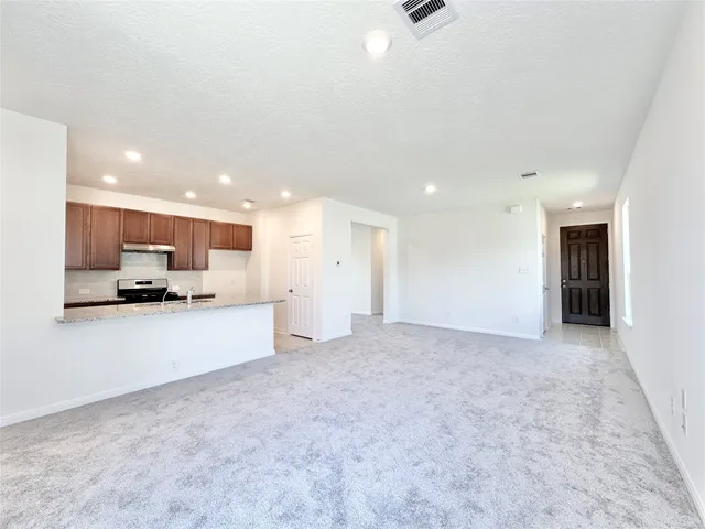 a view of kitchen with refrigerator sink and a counter top space