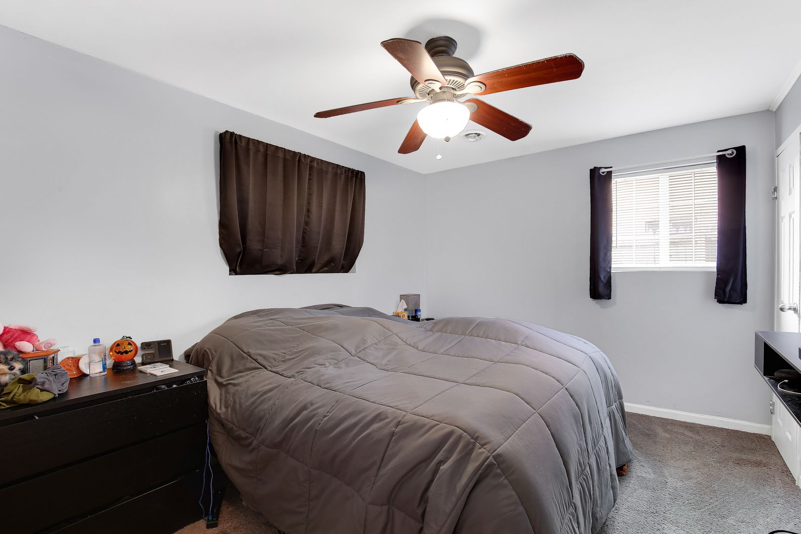 38 Monee Road Park Forest, IL 60466 - Photo 11 of 19 a bedroom with a bed and a chandelier