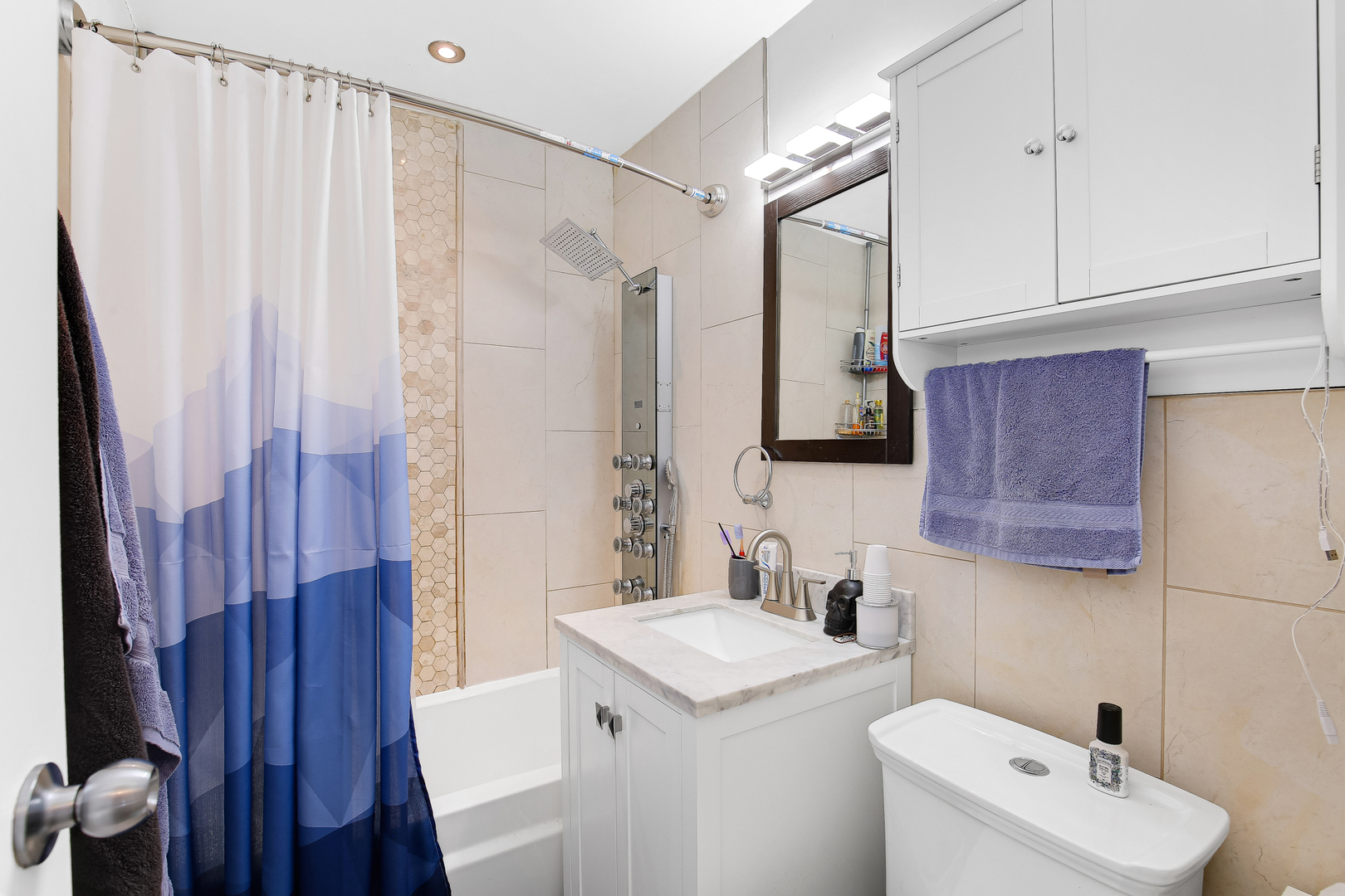 38 Monee Road Park Forest, IL 60466 - Photo 14 of 19 a bathroom with a sink a toilet and shower curtain