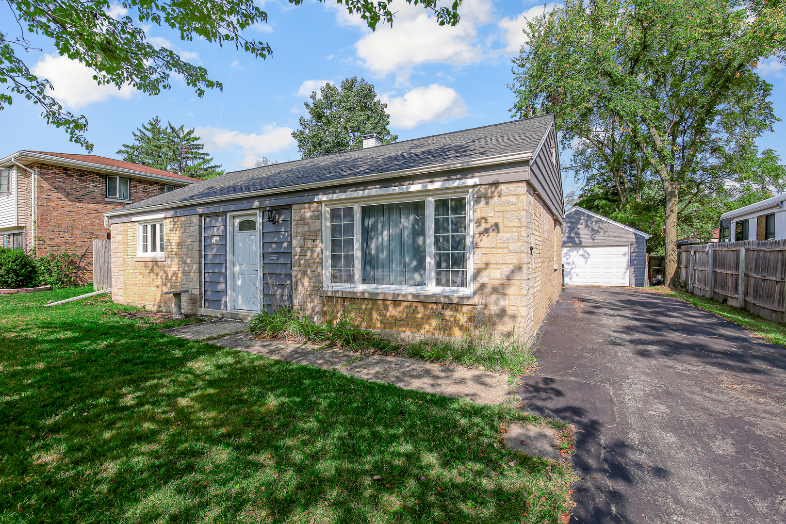 38 Monee Road Park Forest, IL 60466 - Photo 3 of 19 a front view of a house with garden
