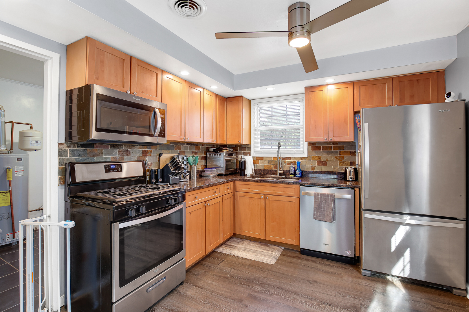 38 Monee Road Park Forest, IL 60466 - Photo 8 of 19 a kitchen with stainless steel appliances a refrigerator sink and microwave