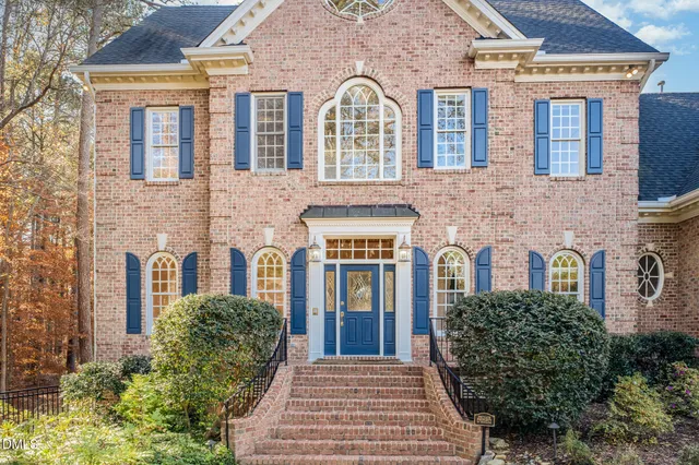 a large kitchen with stainless steel appliances granite countertop a stove and a sink