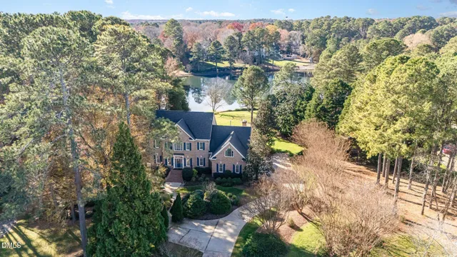 a view of an empty room with a fireplace and a flat screen tv