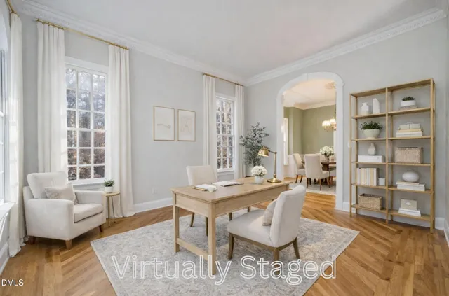 an empty room with a window and doors