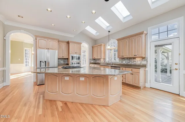 a front view of a house with a yard table and chairs