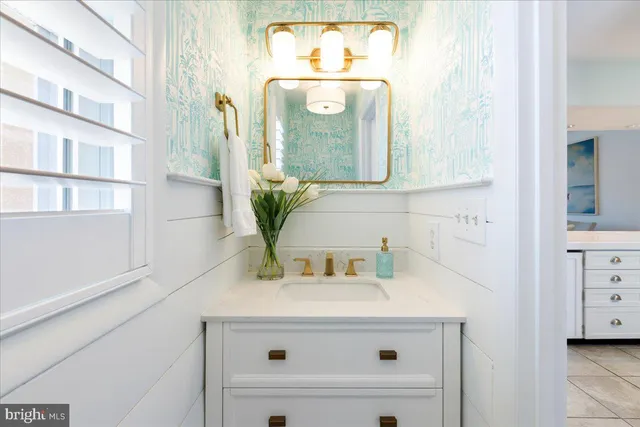 a view of a dining room with furniture a chandelier and wooden floor