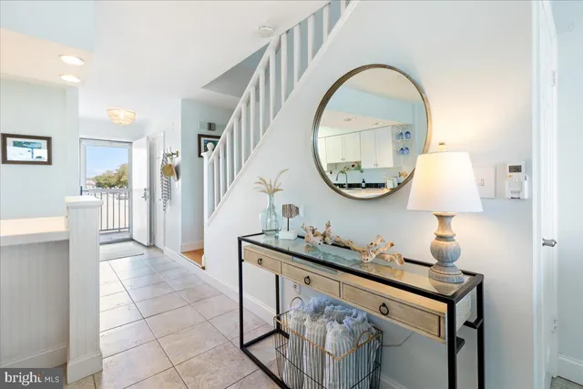 a bedroom with a bed and a night stand