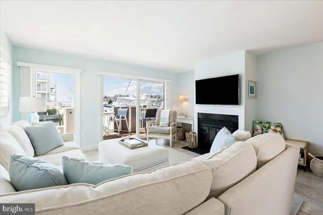 a view of a hallway with wooden floor and closet