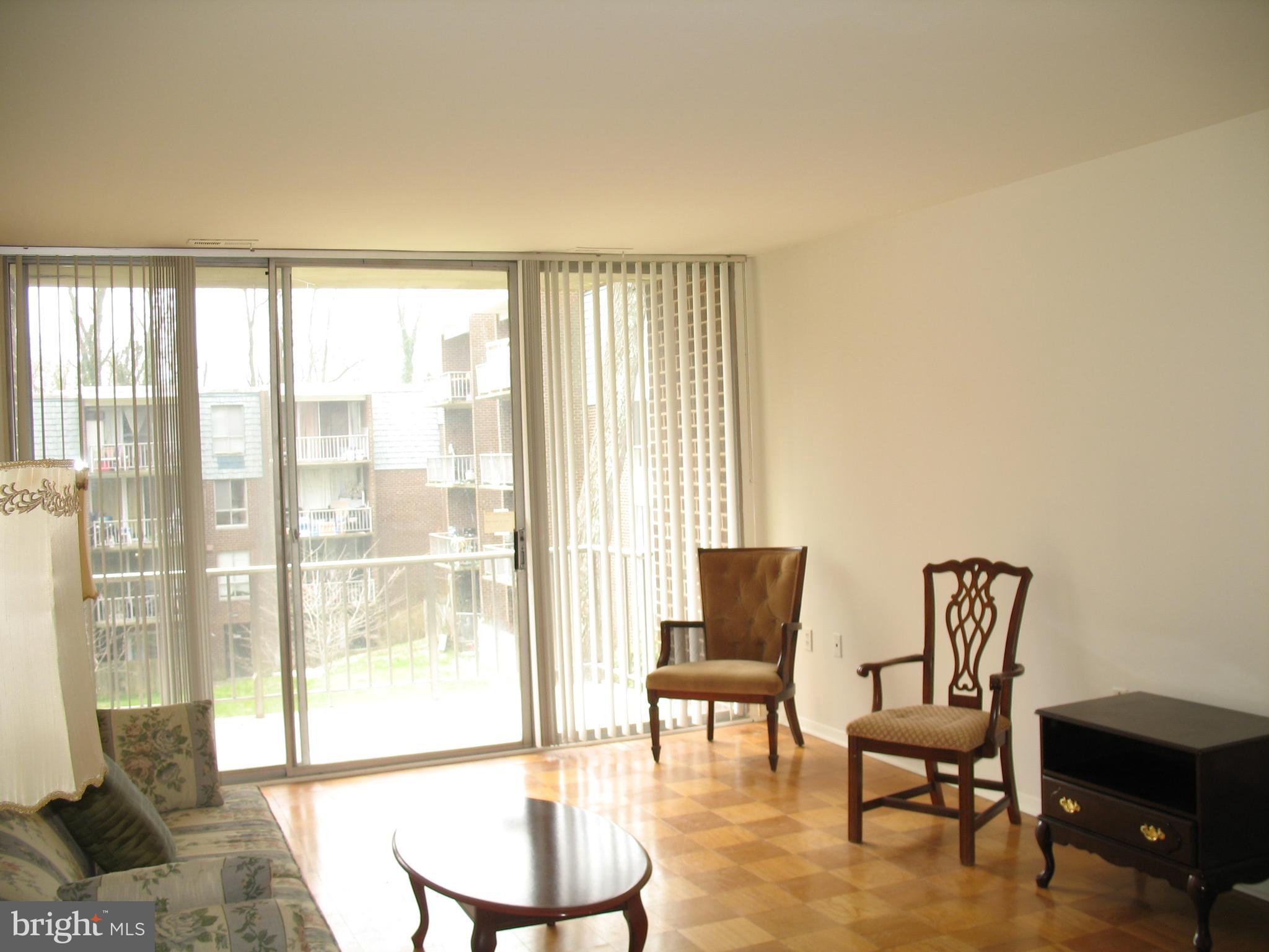 3970 Bel Pre Road, Unit 39705 Silver Spring, MD 20906 - Photo 17 of 30 Living room with balacony