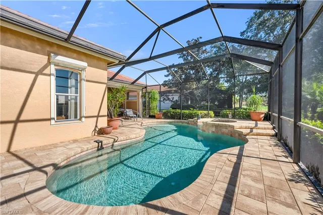 a view of a swimming pool with a patio