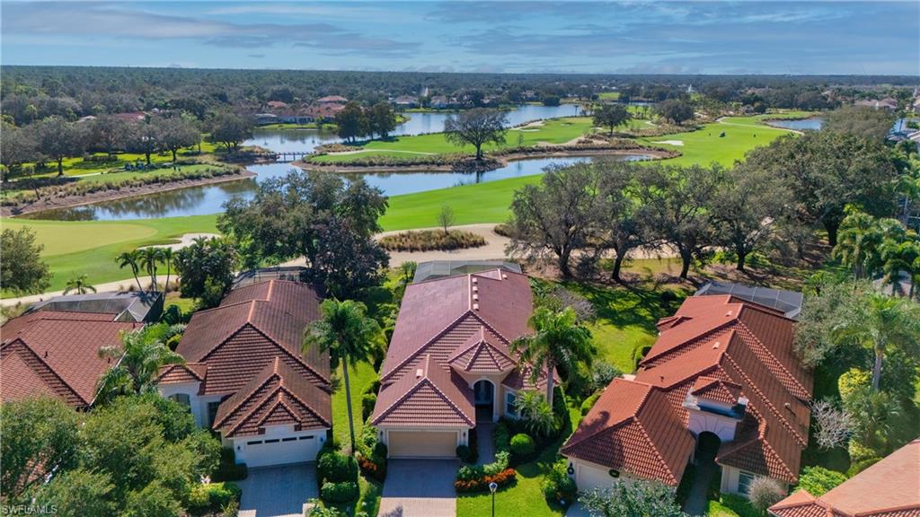 1033 Tierra Lago Way Naples, FL 34119 - Photo 6 of 27 an aerial view of a house with a garden and lake view