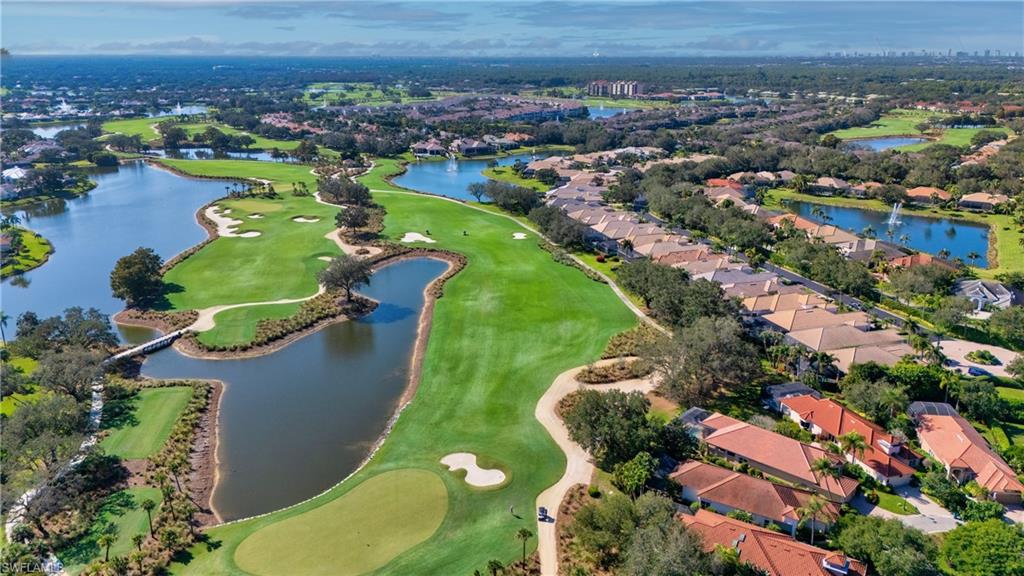 1033 Tierra Lago Way Naples, FL 34119 - Photo 9 of 27 an aerial view of a house with a garden
