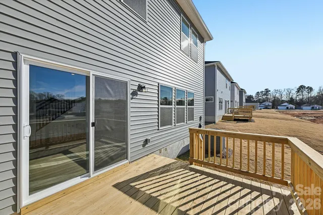 a view of a balcony with two chairs