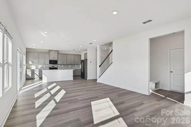 a view of kitchen dining table chairs microwave and cabinets