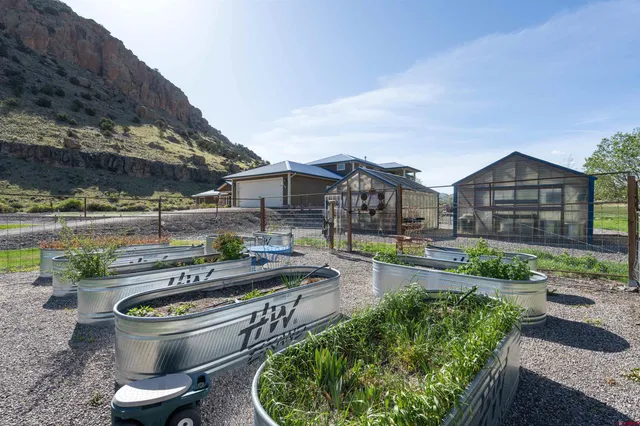 a view of a patio with chair and tables