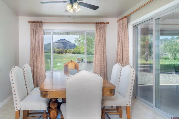 a view of a dining room with furniture wooden floor and a chandelier