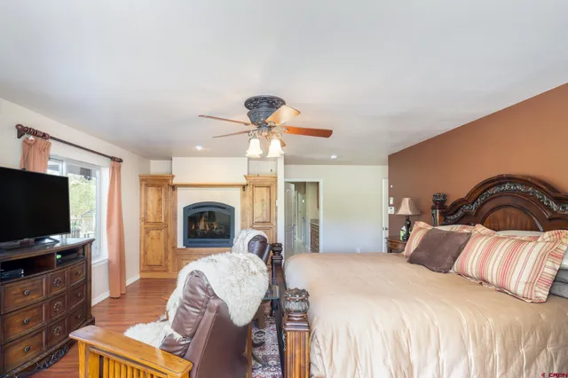 a bedroom with a bed and a fireplace