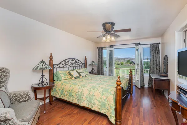 a bed room with a bed and a chandelier