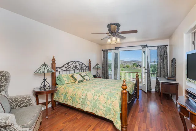 a bed room with a bed and a chandelier