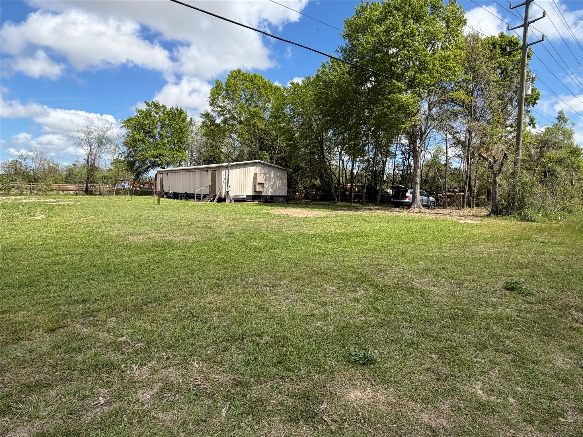 26630 Betka Road Hockley, TX 77447 - Photo 3 of 11 Trailer/mobile unit can be added for an additional rent amount. Shaded tree area lot on far right is not included in this listing but can be added if tenant desires the additional space.