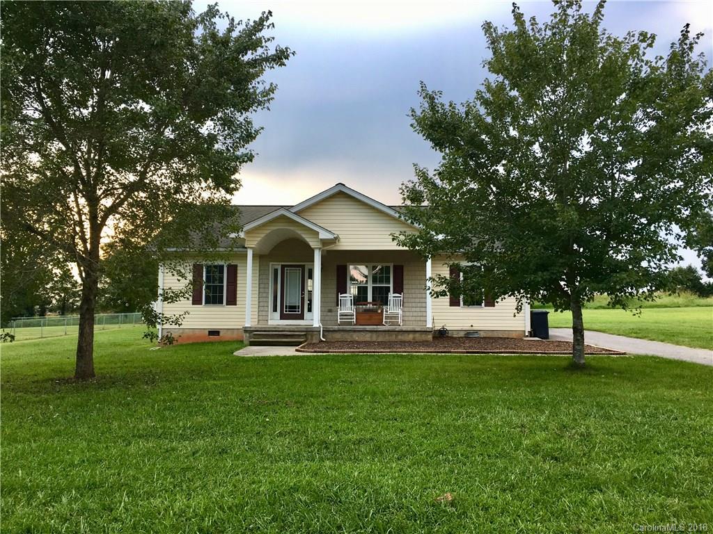 1045 Tabor Road, Unit 21 Olin, NC 28660 - Photo 1 of 23 a front view of a house with a yard