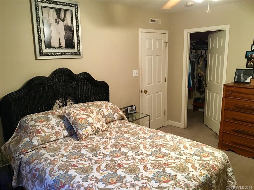 1045 Tabor Road, Unit 21 Olin, NC 28660 - Photo 11 of 23 a bedroom with a bed and a dresser