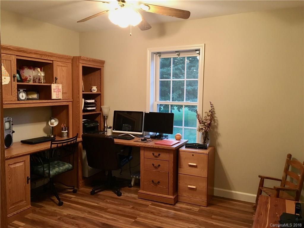 1045 Tabor Road, Unit 21 Olin, NC 28660 - Photo 14 of 23 a view of a workspace with furniture and a window