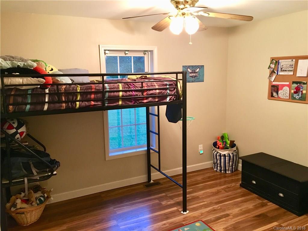 1045 Tabor Road, Unit 21 Olin, NC 28660 - Photo 15 of 23 a view of a workspace with furniture and wooden floor