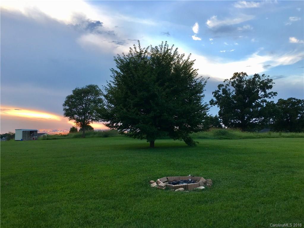 1045 Tabor Road, Unit 21 Olin, NC 28660 - Photo 17 of 23 a backyard of a house with lots of green space