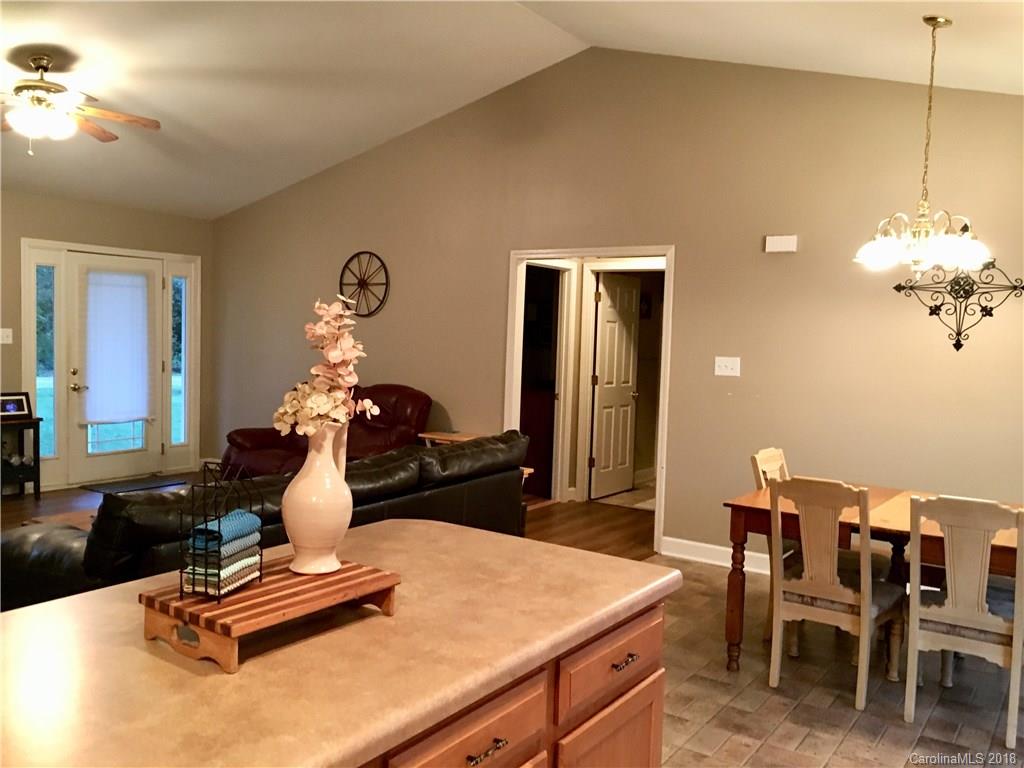 1045 Tabor Road, Unit 21 Olin, NC 28660 - Photo 6 of 23 a room with a table chairs and chandelier