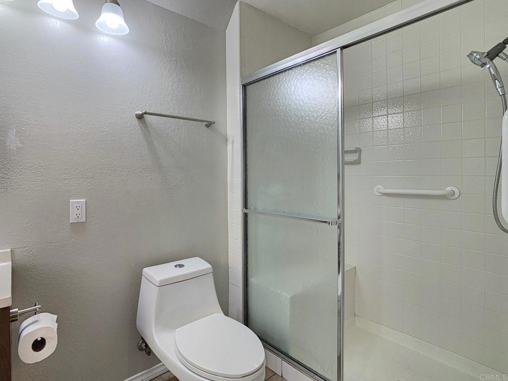 2758 Windmill View Road El Cajon, CA 92020 - Photo 18 of 24 a white toilet sitting next to a bathroom sink