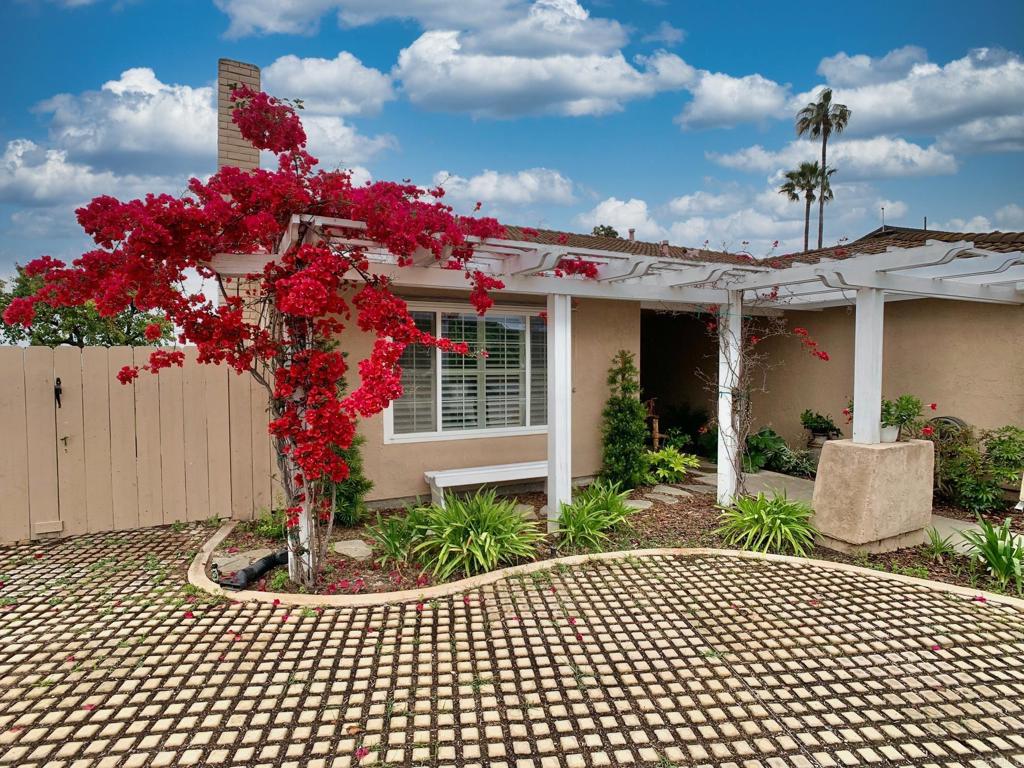 2758 Windmill View Road El Cajon, CA 92020 - Photo 2 of 24 a front view of a house with a yard
