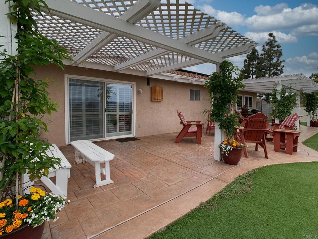 2758 Windmill View Road El Cajon, CA 92020 - Photo 21 of 24 a front view of a house with sitting space and garden
