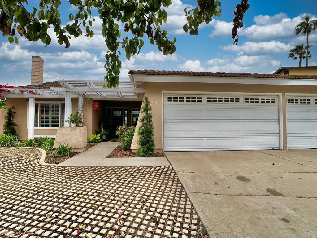 2758 Windmill View Road El Cajon, CA 92020 - Photo 4 of 24 a front view of a house with a yard